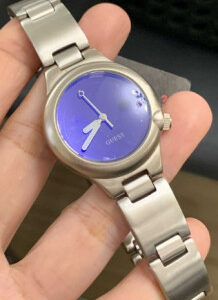 GUESS, Silver Tone Round Case w/ Blue Iridescent Dial, Quarts Movement, Silver Stainless Steel Bracelet w/ Deployant Clasp | EKT0423